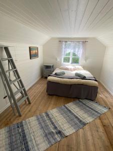 Postel nebo postele na pokoji v ubytování Ingmarsö B&B