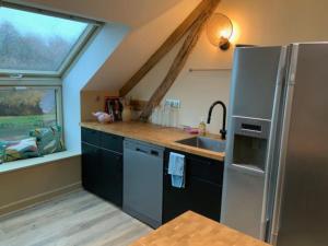 Kuchyň nebo kuchyňský kout v ubytování Appartement spacieux au domaine