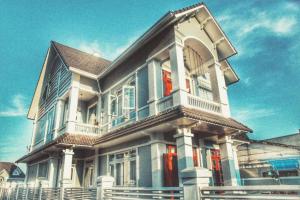 a large house with a balcony on top of it at Dalat CASA in Ấp Kim Thạch