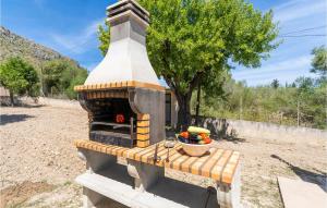 a outdoor oven with a pot on top of it at Cozy Home In Puerto De Alcudia in Port d'Alcudia