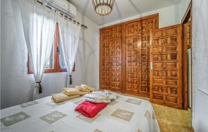 Postel nebo postele na pokoji v ubytování Denia