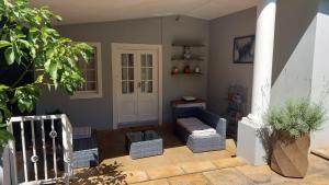 a living room with a couch and a table at Familia in Pietermaritzburg