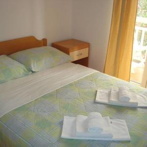 Postel nebo postele na pokoji v ubytování Apartments Markota
