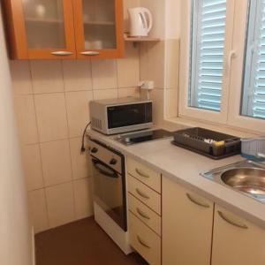 Kuchyň nebo kuchyňský kout v ubytování Apartments Markota