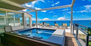 a house with a swimming pool on a deck at Hotel Villa Letizia in Bardolino