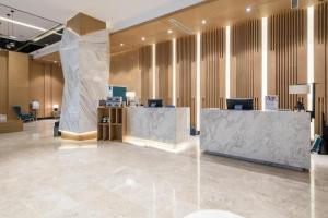 Ο χώρος του λόμπι ή της ρεσεψιόν στο Quality Hotel Chengdu