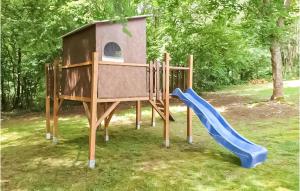 a playground with a blue slide and a play house at Ferienhaus 14 In Thalfang in Thalfang +16 photos