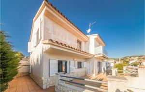 a large white house with a porch and stairs at Gorgeous Home In Sant Cebrià De Vallalt in Sant Cebrià de Vallalta