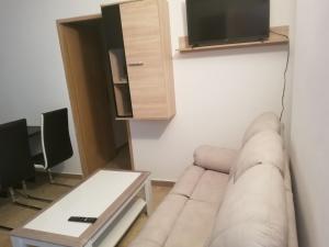 a living room with a couch and a table at Villa Marko 3 Bedrooms apartment in Pula