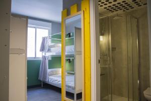 a room with a bunk bed and a mirror at Room Valencia in Valencia