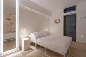 Postel nebo postele na pokoji v ubytování TRULOCO NUZZI - LUXURY DOMUS