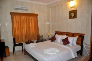 Postel nebo postele na pokoji v ubytování Peace Inn Chennai + 37 fotografií