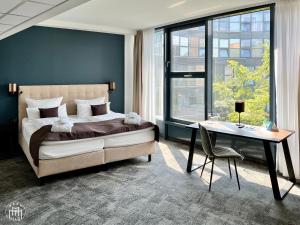 Postel nebo postele na pokoji v ubytování Hotel am Borsigturm