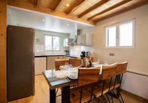 a kitchen and dining room with a table and chairs at Le pic-vert in Bolquere Pyrenees 2000
