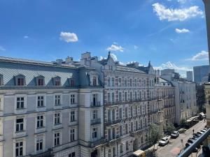 a view of a large building in a city at ComeWa Apartments in Warsaw