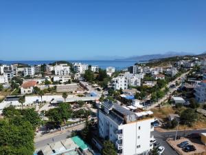 an aerial view of a city with the ocean at Ilio Boutique Hotel in Ksamil