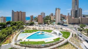 a view of a city with a swimming pool at Benidorm Beach, Grupo AMI in Benidorm