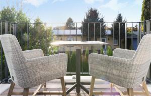 a pair of chairs and a table on a patio at Baltischer Hof Apartment 31 in Boltenhagen