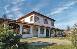 a white house with a red roof at Villa Il Colle in Molezzano