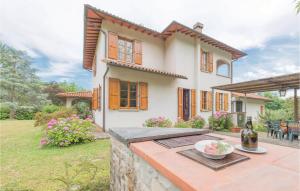 a house with a table in front of it at Villa Il Colle in Molezzano +23 photos