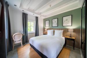 Postel nebo postele na pokoji v ubytování Hôtel Château Schengen