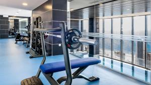 a gym with cardio equipment in a building at Benidorm Beach, Grupo AMI in Benidorm