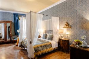 Postel nebo postele na pokoji v ubytování Hotel Palazzo dal Borgo