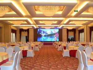 TV a/nebo společenská místnost v ubytování Days Hotel & Suites Hengan Chongqing + 76 fotografií