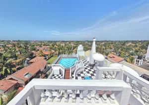 an aerial view of a house with a swimming pool at Hotel Royal Castle in Ettukala