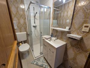 Koupelna v ubytování Hotel Garni Hutter