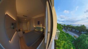 a balcony of a building with a view of a street at Hotel Tritone in Trieste