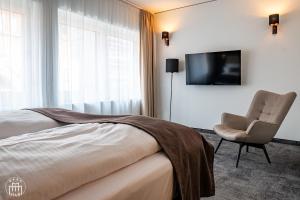 TV a/nebo společenská místnost v ubytování Hotel am Borsigturm