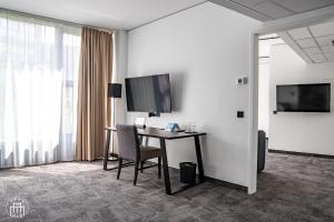 TV a/nebo společenská místnost v ubytování Hotel am Borsigturm