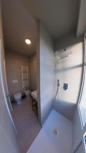 a bathroom with a toilet and a sink at Hotel Tritone in Trieste