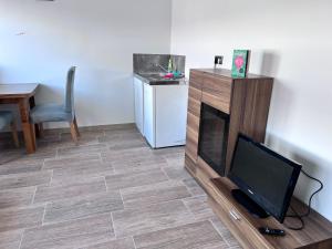 TV a/nebo společenská místnost v ubytování TOP 1 Zimmer für 1-2Personen