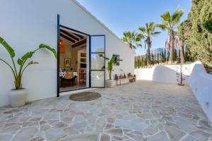 a house on the beach with a patio at Naraya - Managed By Almarina Villas in Jávea