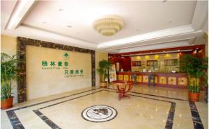 a lobby of a building with a sign on the wall at GreenTree Inn HeFei LongChuan Road South Hefei Railway Station Business Hotel in Hefei