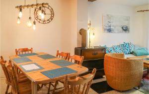 a dining room with a table and chairs at Amazing Home In Prerow With Wifi in Prerow