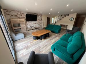 a living room with a couch and a table at VILLA RINCON DEL BUITRE in Moratalla