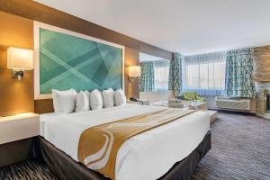 A bed or beds in a room at Quality Inn