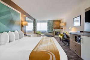 A bed or beds in a room at Quality Inn