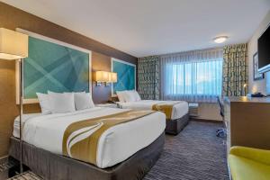 A bed or beds in a room at Quality Inn