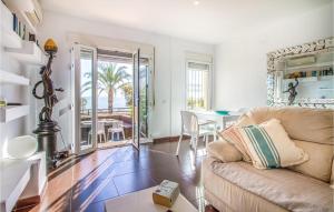 a living room with a couch and a table at Nice Home In San Javier With Wifi in San Javier