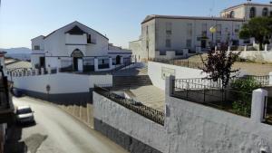 arial view of a city with a building and a street at Alojamientos Rurales Los Molinos in Fuentes de León