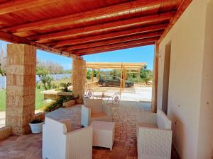 Posezení v ubytování Ugento Country Cottage - Villa con Piscina 10 posti - Salento