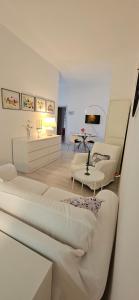 a living room with two beds and a table at Villa Jolanda in Citta' Sant'Angelo