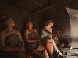 a group of three women sitting in a room at Eurohostel in Helsinki
