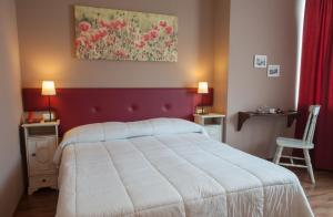 Postel nebo postele na pokoji v ubytování Ankon Hotel