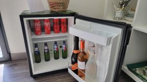an open refrigerator filled with lots of wine bottles at Chez Jeff & Aurélie in Draguignan