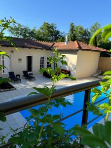 a view of the house from the garden at Villa RELAX Miševići in Sarajevo